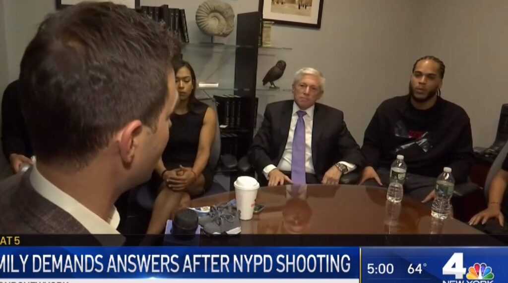 attorney robert vilensky sitting with family of bronx police shooting victim